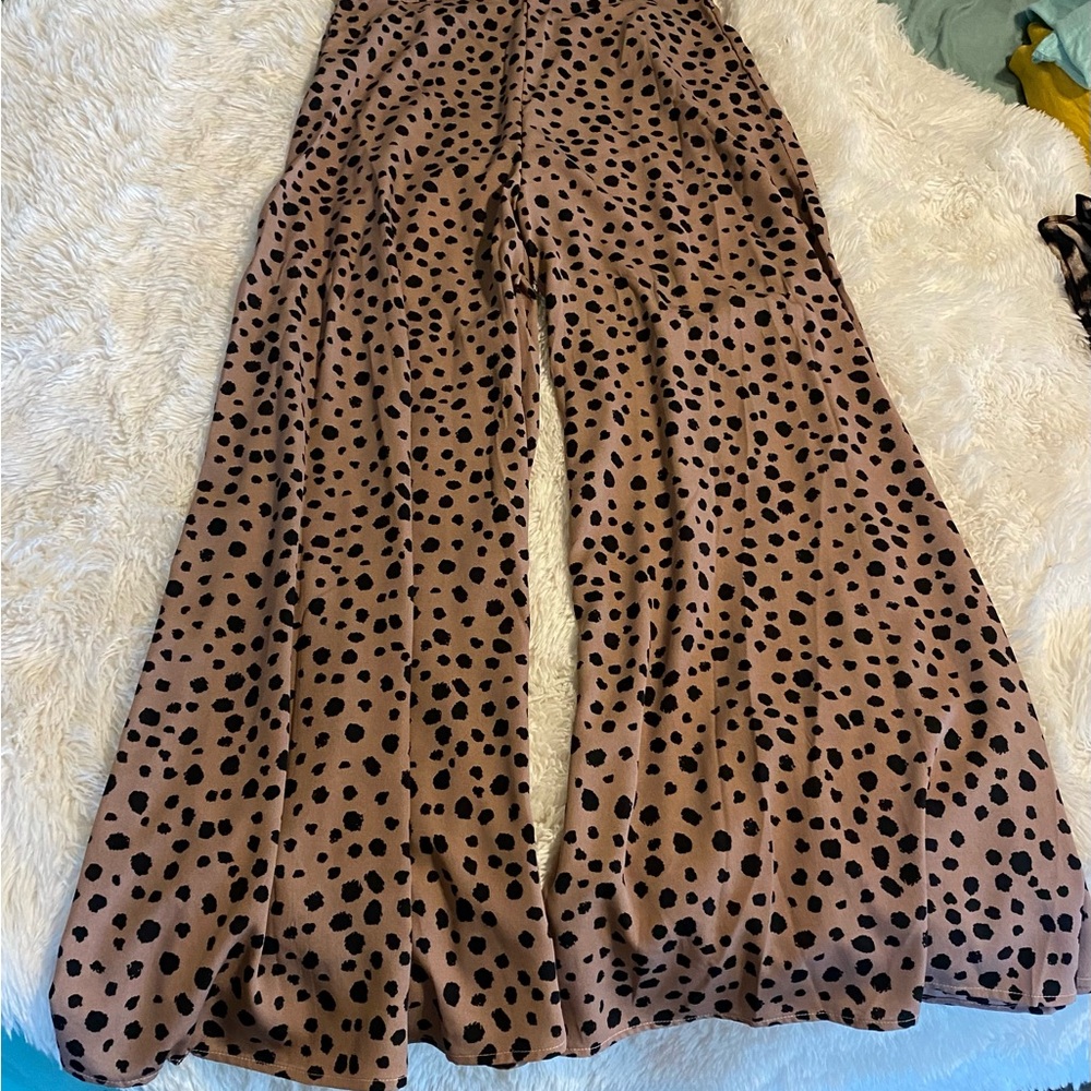 Brand new, never worn. Satin feeling- wide/flowy pants